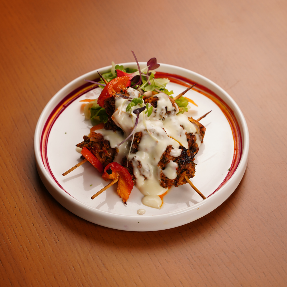 CHERMOURA MARINATED CHICKEN, HOT HONEY DRIZZLE